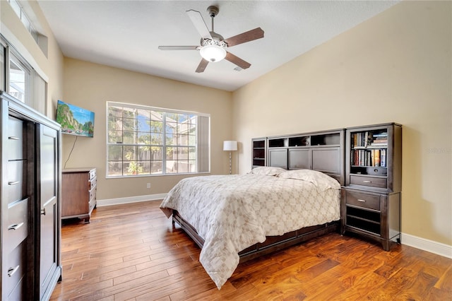 bedroom featuring hardwood / wood-style floors and ceiling fan