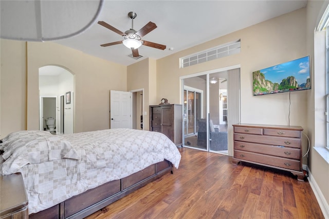 bedroom featuring multiple windows, hardwood / wood-style floors, ceiling fan, and access to exterior