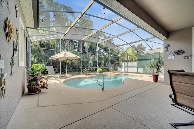 view of pool featuring a lanai and a patio