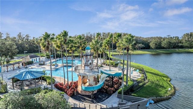 view of swimming pool featuring a water slide and a water view