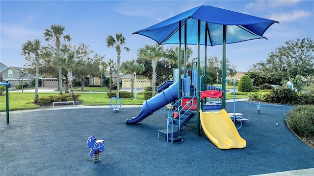 view of jungle gym featuring a lawn