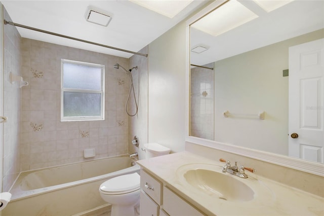 full bathroom with tiled shower / bath combo, toilet, and vanity