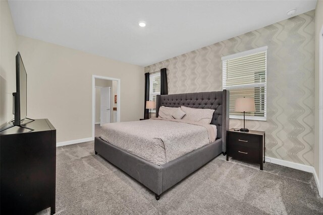 730 Drop Shot Dr, Davenport, FL 33896 - carpeted bedroom with baseboards and wallpapered walls