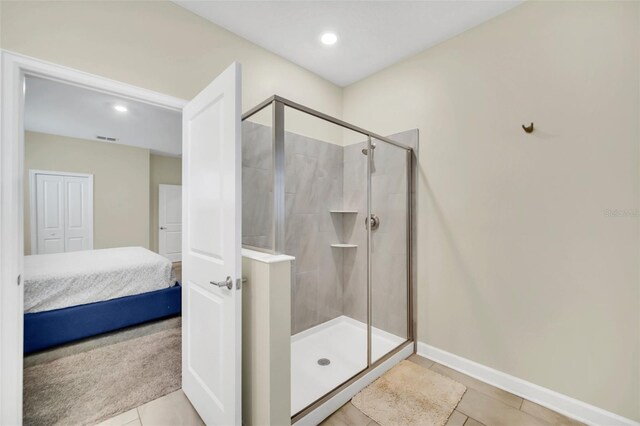 730 Drop Shot Dr, Davenport, FL 33896 - bathroom with ensuite bathroom, a stall shower, tile patterned flooring, baseboards, and recessed lighting