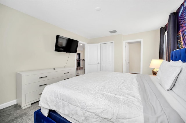 carpeted bedroom with a closet