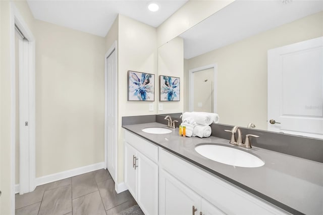 bathroom featuring vanity and tile patterned flooring