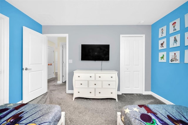 carpeted bedroom featuring a closet