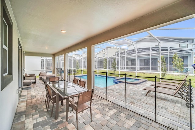 sunroom featuring vaulted ceiling and a pool