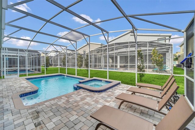730 Drop Shot Dr, Davenport, FL 33896 - view of pool featuring a yard, a patio, a pool with connected hot tub, and a lanai