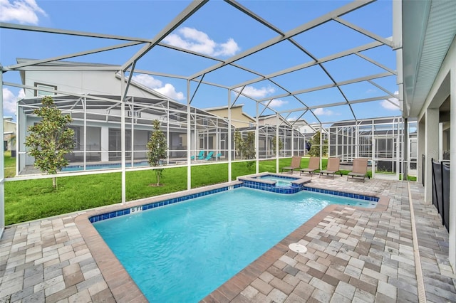 view of swimming pool with an in ground hot tub, a patio, and a lanai