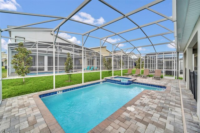 730 Drop Shot Dr, Davenport, FL 33896 - view of swimming pool with a lawn, a patio, a pool with connected hot tub, and glass enclosure