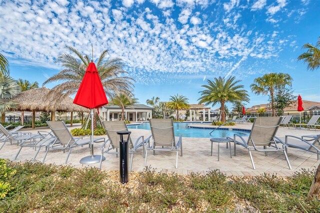 730 Drop Shot Dr, Davenport, FL 33896 - community pool featuring a patio