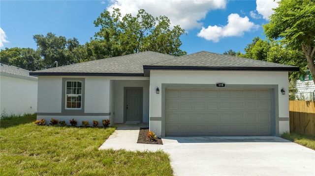 ranch-style home featuring a front lawn and a garage