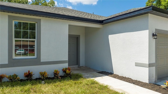 entrance to property featuring a garage