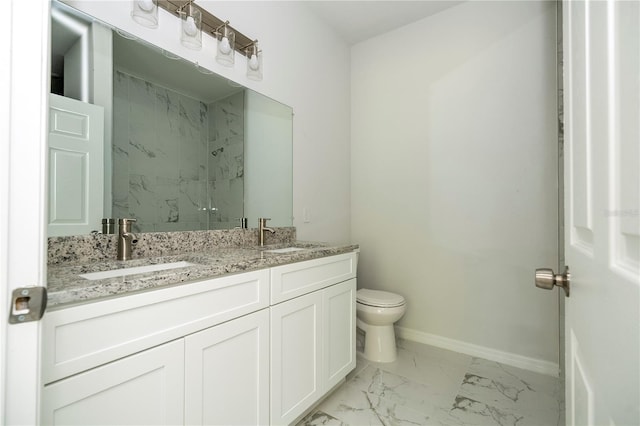 bathroom featuring vanity, toilet, and walk in shower