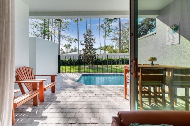 view of swimming pool with a patio area