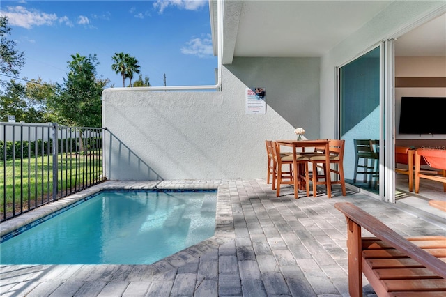 view of pool featuring a patio