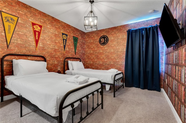 carpeted bedroom with brick wall and an inviting chandelier