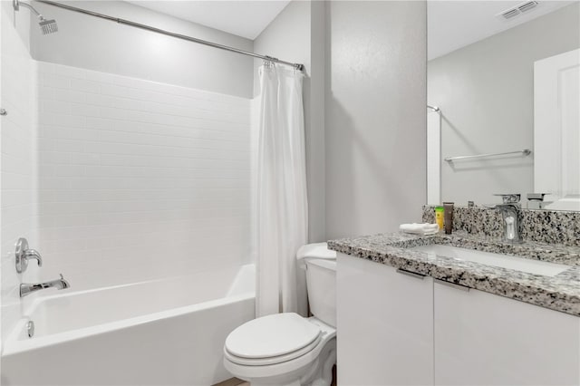 full bathroom featuring vanity, toilet, and shower / tub combo