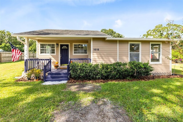 view of front facade featuring a front lawn and covered porch