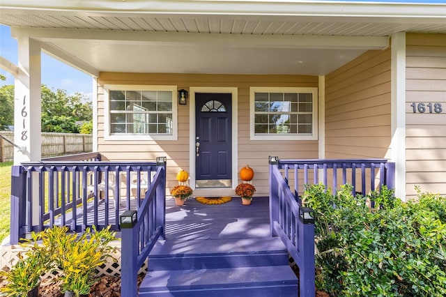 doorway to property featuring covered porch