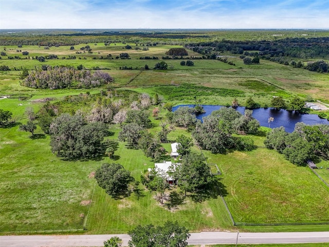 drone / aerial view featuring a water view and a rural view