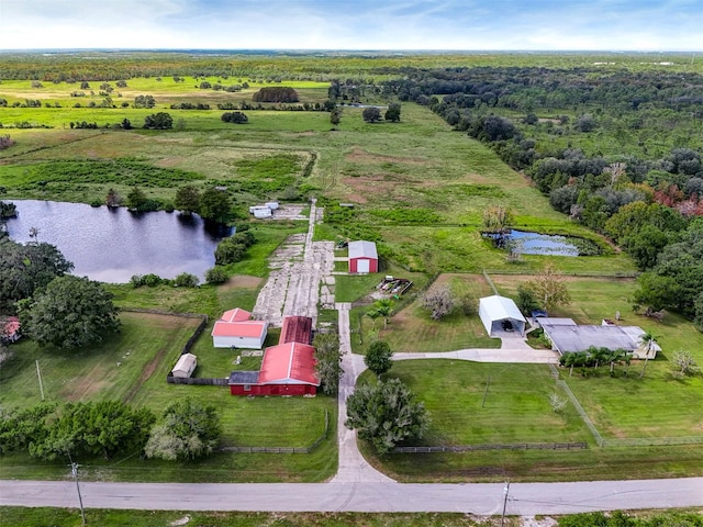 birds eye view of property with a rural view and a water view