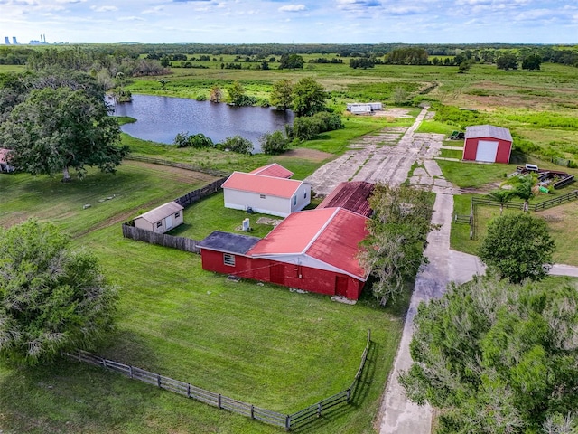 birds eye view of property with a rural view and a water view