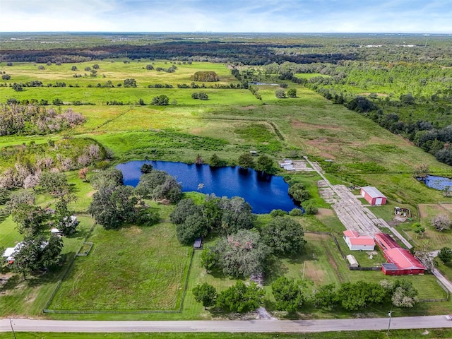 drone / aerial view with a water view and a rural view