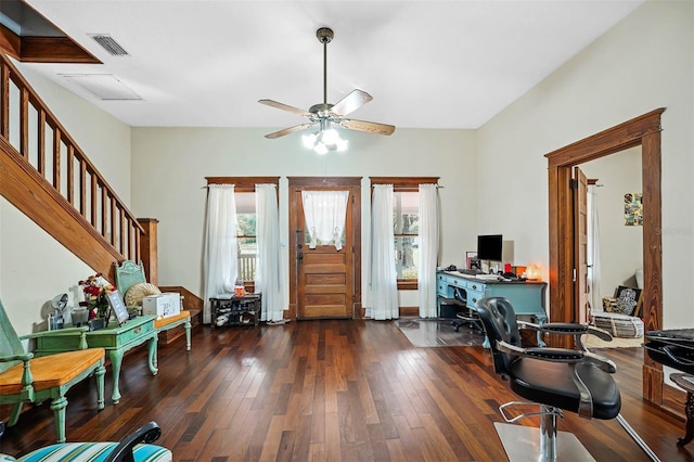 foyer entrance featuring ceiling fan, built in desk, and dark hardwood / wood-style flooring