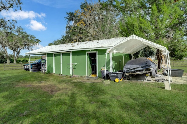 view of outbuilding with a lawn