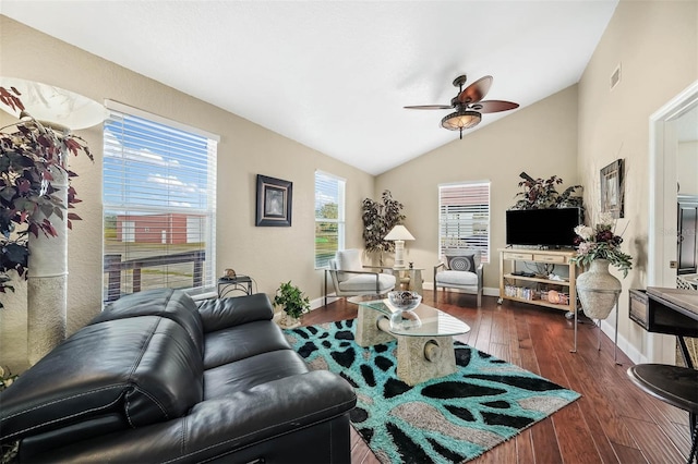 living room featuring ceiling fan, dark wood-type flooring, and vaulted ceiling