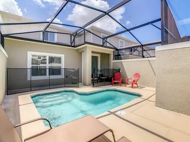 view of pool featuring a patio area and a lanai