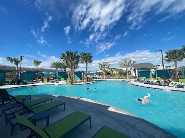 view of swimming pool featuring a patio