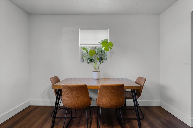 dining room with dark hardwood / wood-style floors