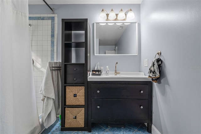 bathroom featuring vanity, tile patterned floors, and walk in shower