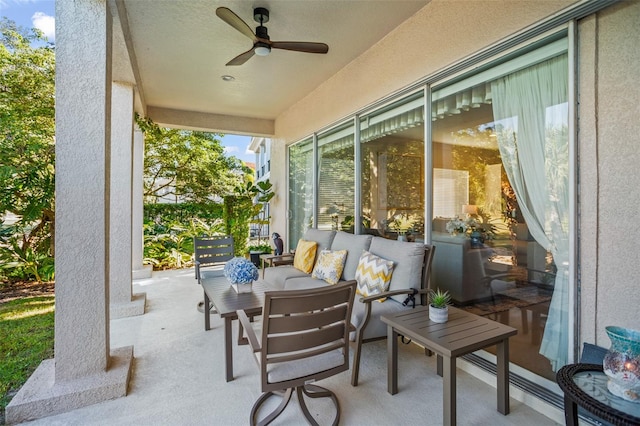 sunroom / solarium featuring ceiling fan