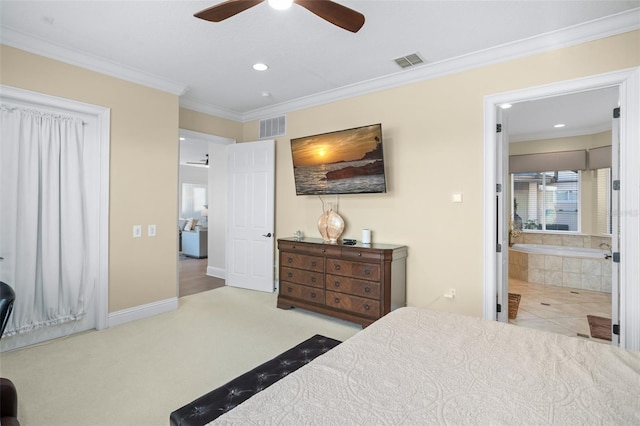 carpeted bedroom with ornamental molding, ensuite bath, and ceiling fan