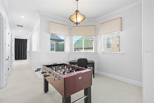 playroom featuring light carpet, a healthy amount of sunlight, and crown molding