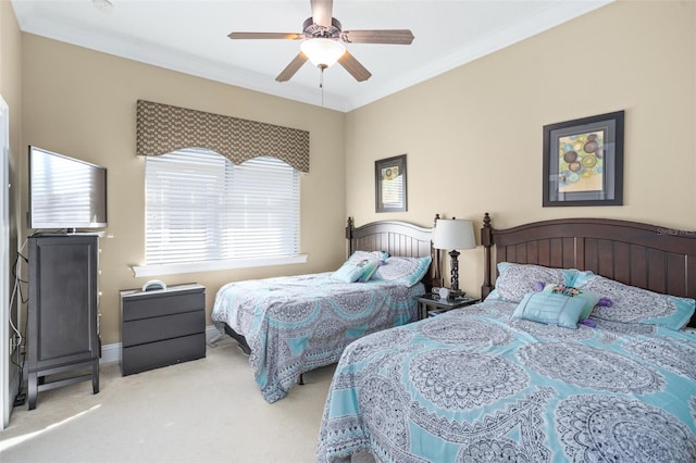 bedroom featuring ornamental molding, light carpet, and ceiling fan