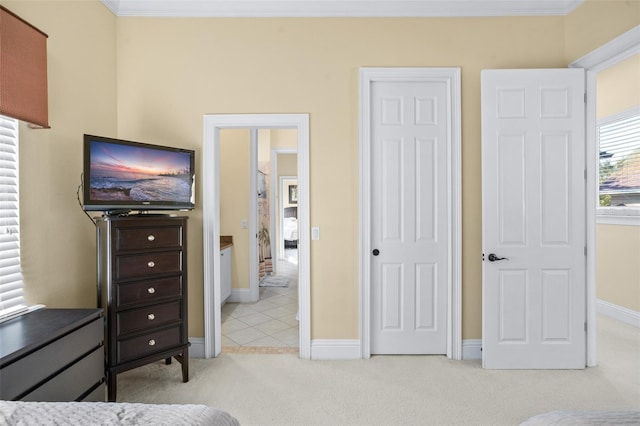 carpeted bedroom with crown molding