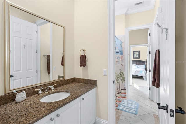 bathroom with vanity, tile patterned floors, and ornamental molding