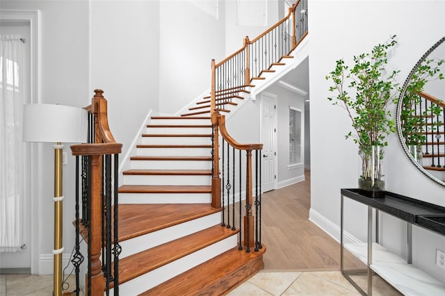 staircase with hardwood / wood-style flooring