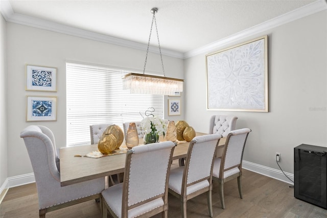 dining area featuring dark hardwood / wood-style flooring and ornamental molding