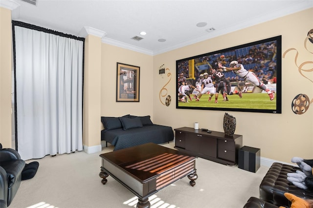 home theater room with light carpet and ornamental molding