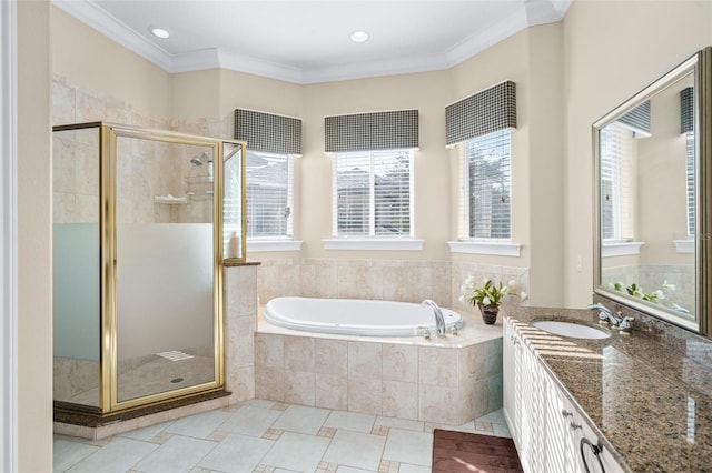 bathroom featuring independent shower and bath, vanity, and ornamental molding