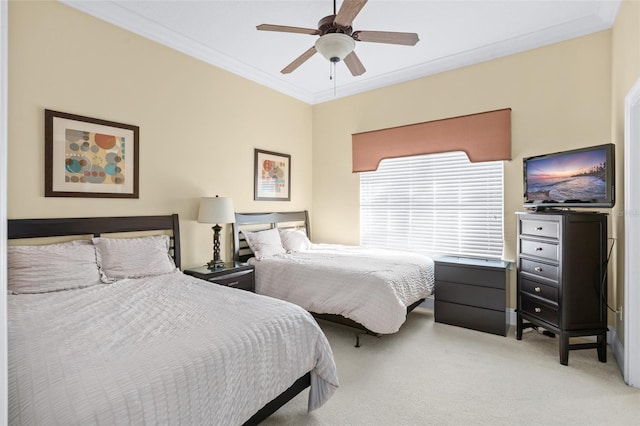 bedroom with ornamental molding, carpet floors, and ceiling fan