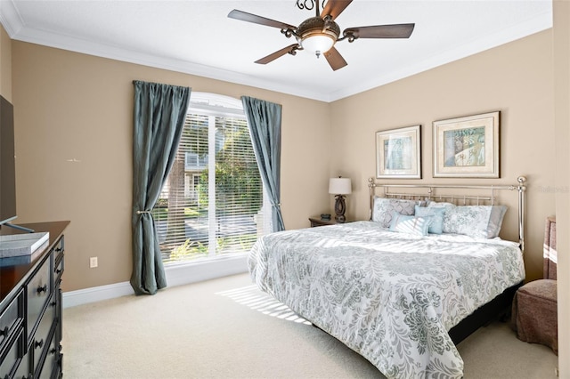 bedroom featuring ceiling fan, light carpet, and ornamental molding