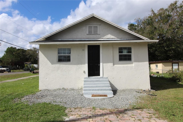 bungalow with a front yard