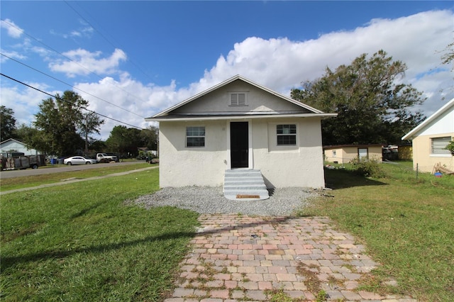 view of front of house with a front lawn